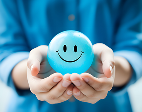 Women holding a smiley face
