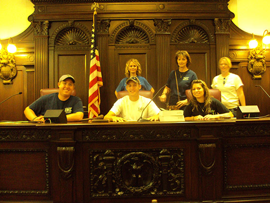 6 people standing together in court room