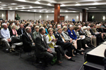 Large Audience sitting and listening 