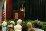 Ling presenting in front of audience