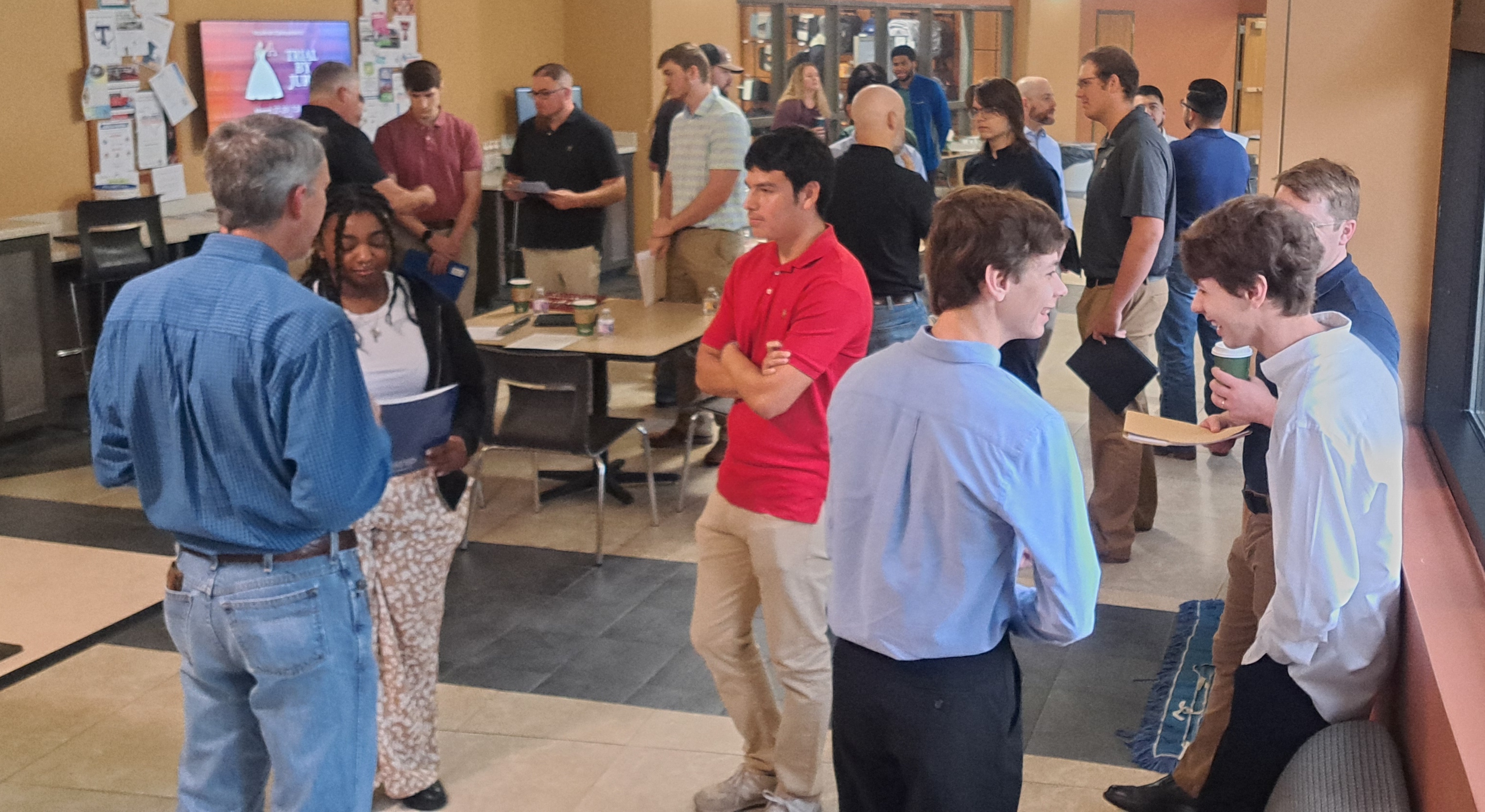 students and employers engaging in conversation