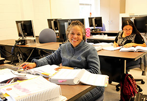 Sitting Woman with textbooks and notebooks