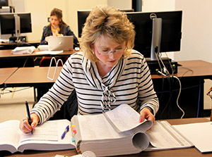 Sitting Woman with textbooks and notebooks