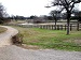 Trail by fence and trees