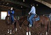 2 women on 2 brown horses