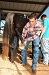 Man handling horse hind legs