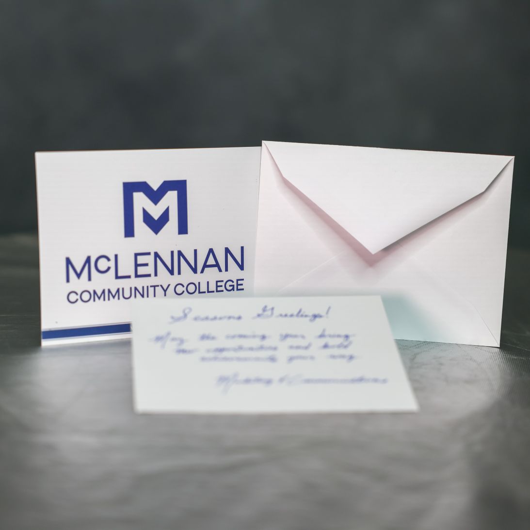 McLennan Community College logo alongside a blank envelope and a handwritten note, presenting a welcoming message.