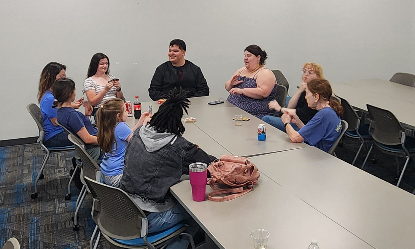 Pi Chi Members playing cards