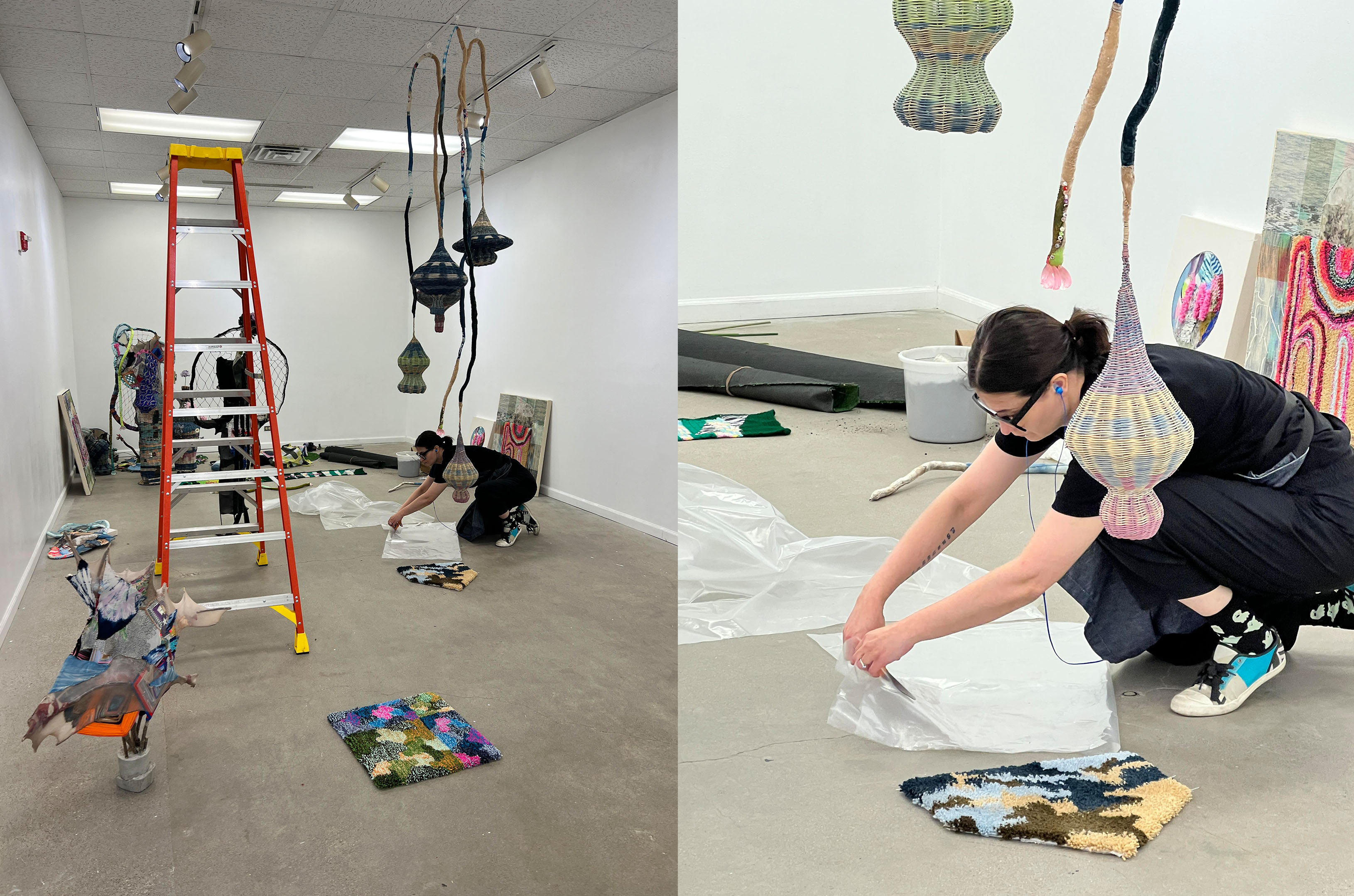 A person is setting up an art installation in a gallery, surrounded by hanging sculptures and various artworks. The scene depicts the preparation for an exhibition, highlighting creativity and artistic expression.